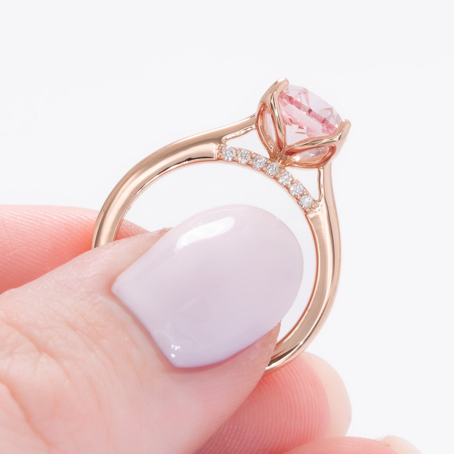 clover floral inspired engagement ring with peach lab sapphire