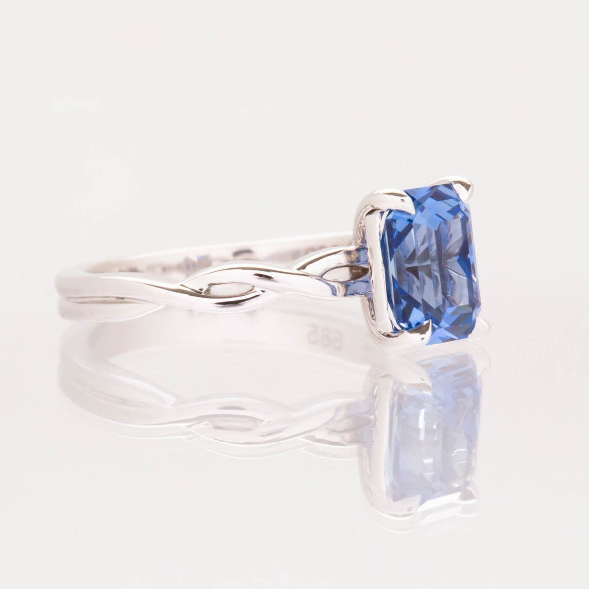 cressida engagement ring with twisted band and radiant lab sapphire