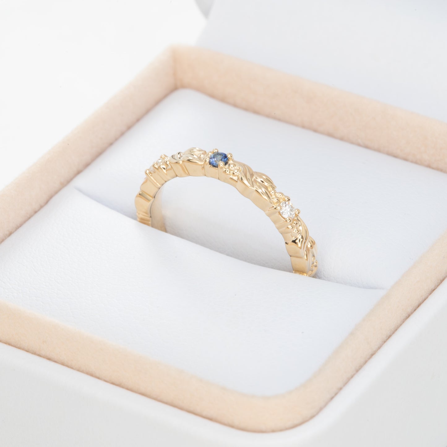 custom gaia band in yellow gold with lab diamonds and blue sapphire