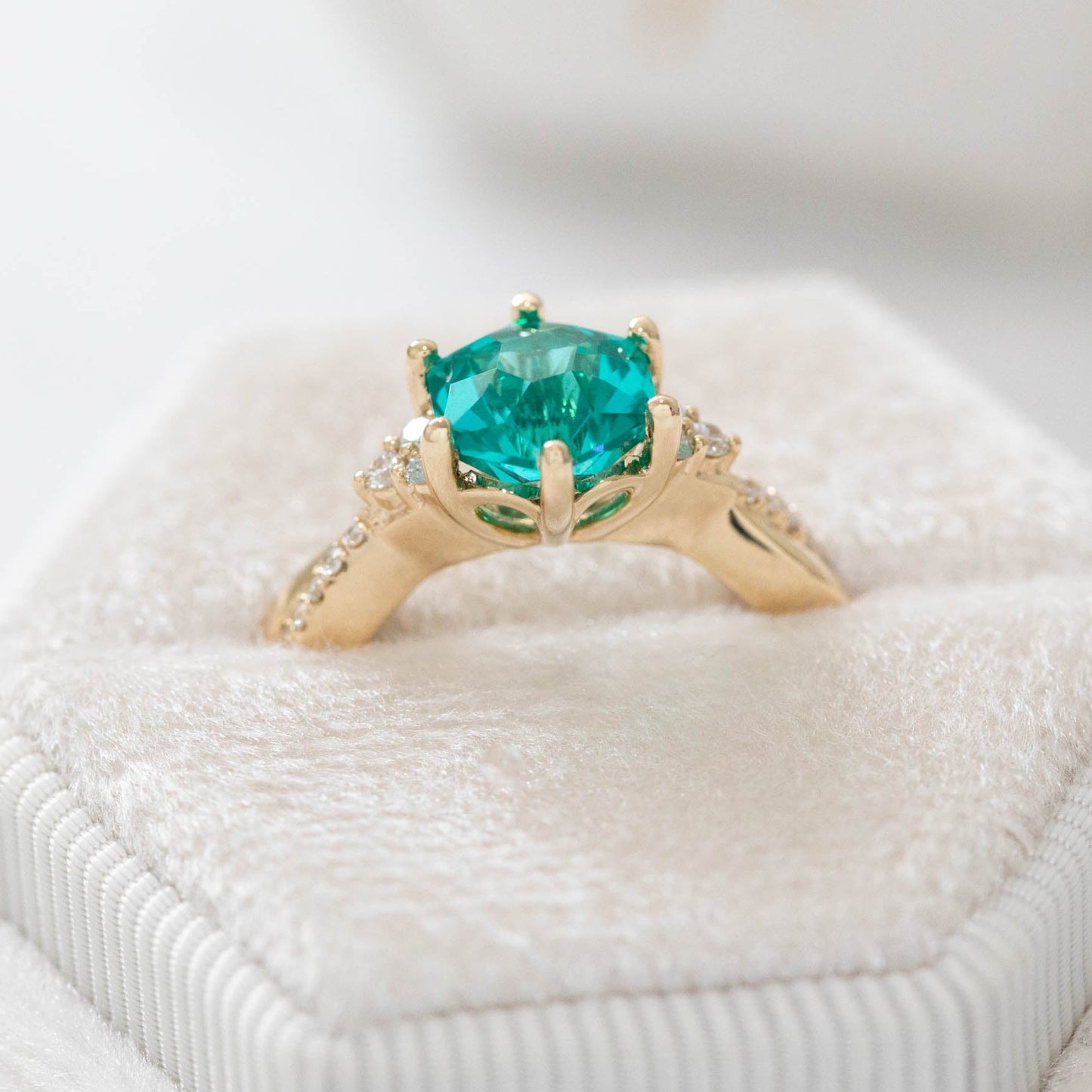teal lab yag hex engagement ring with twisting band