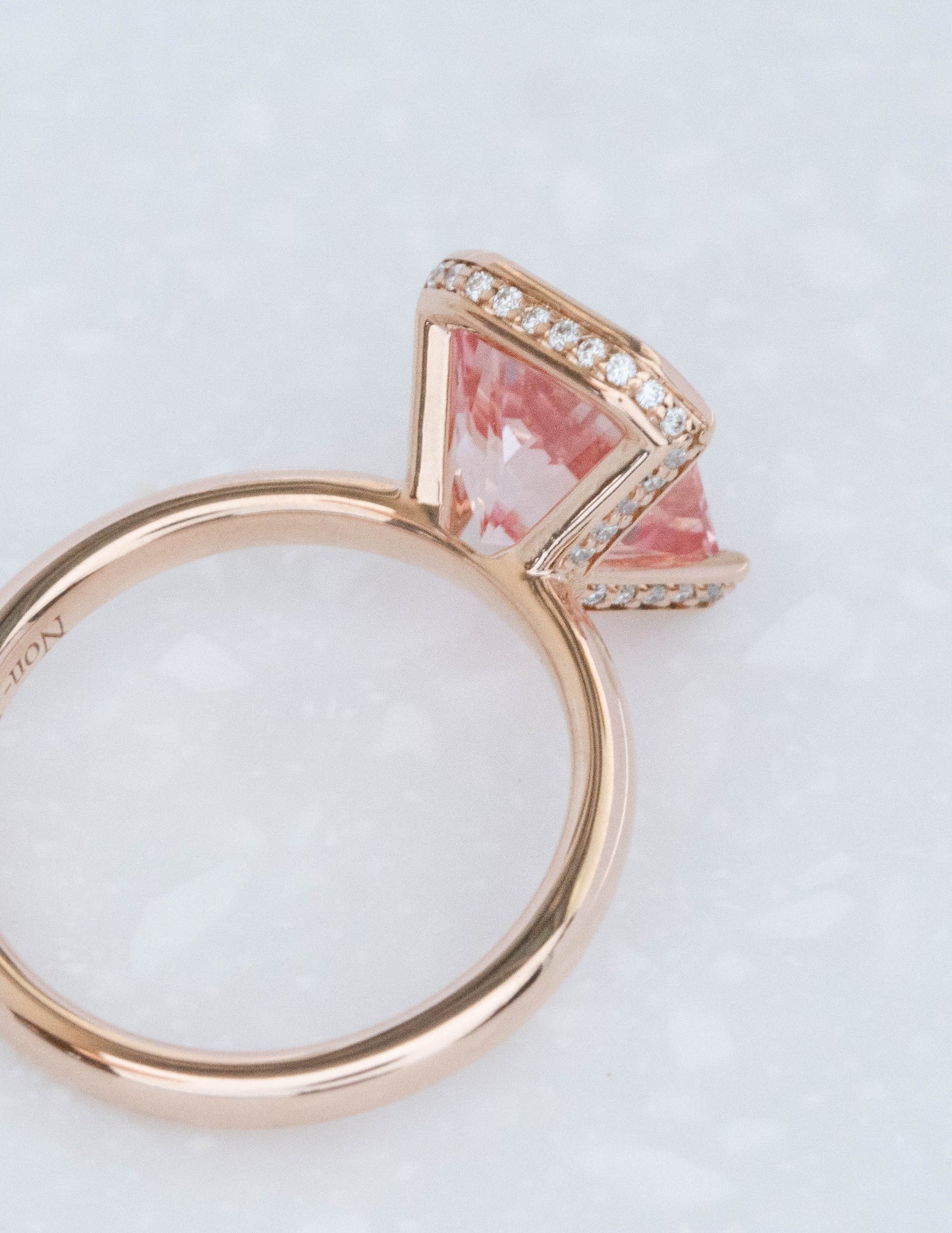 half bezel ring with radiant lab sapphire