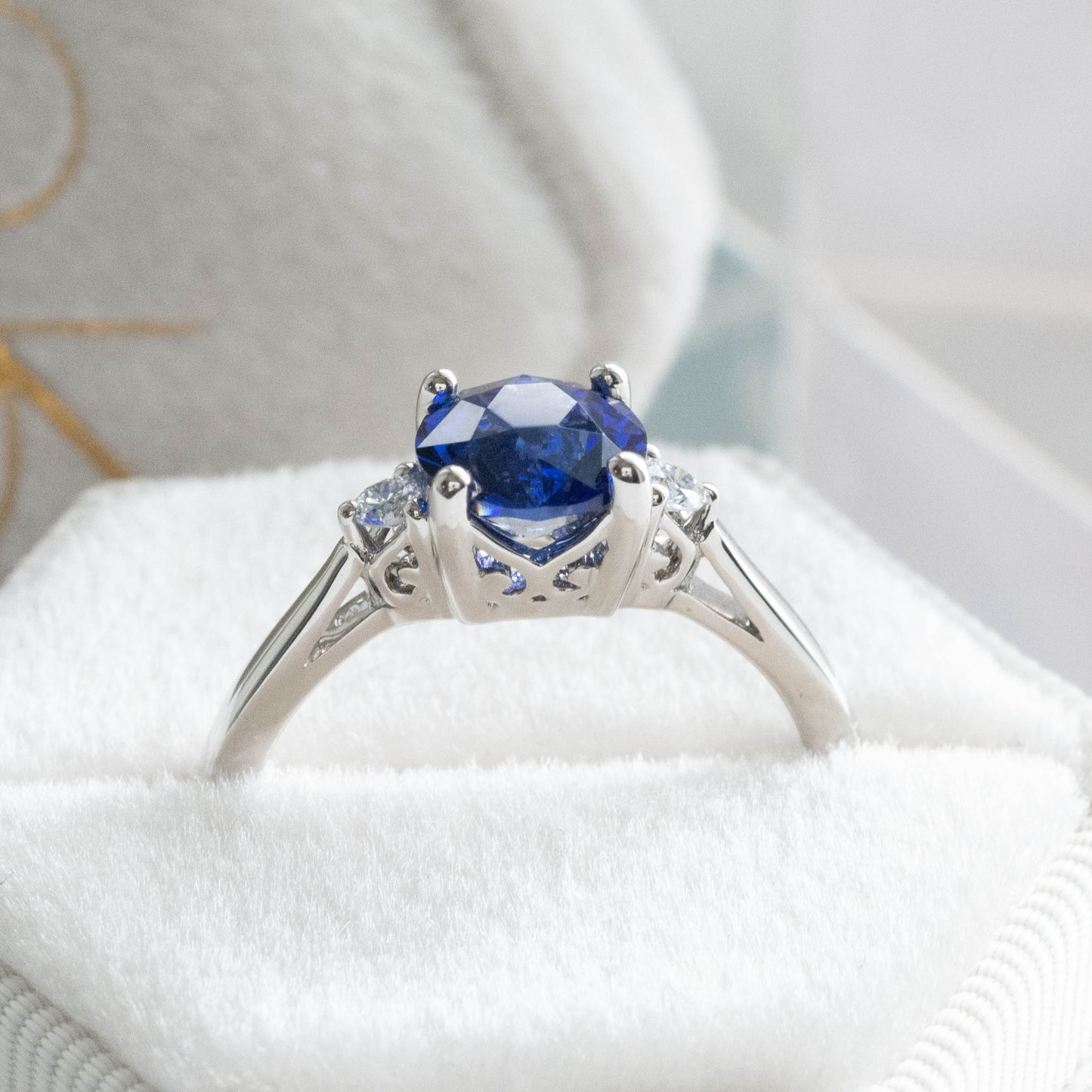 custom engagement ring, three stone with lab sapphire