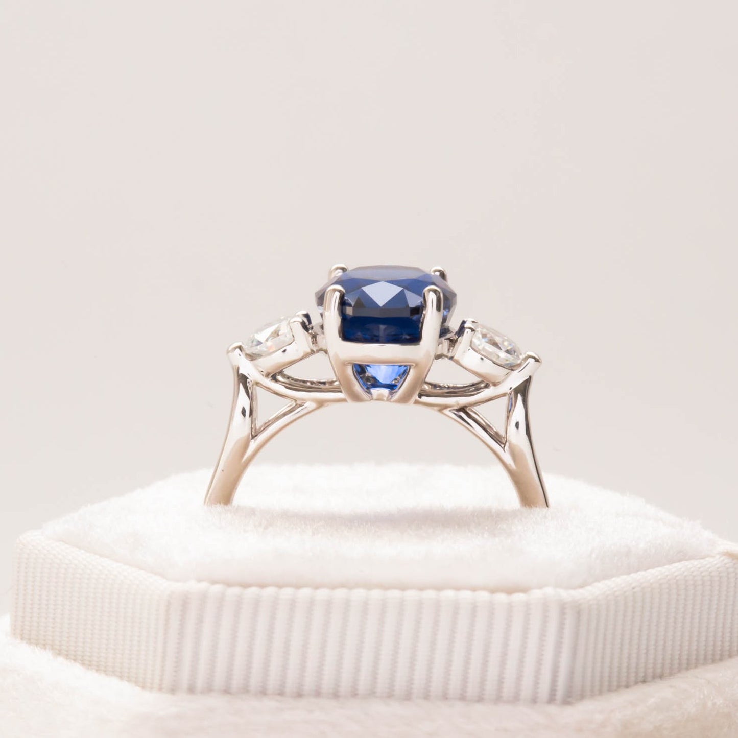 oval royal blue lab sapphire three stone engagement ring