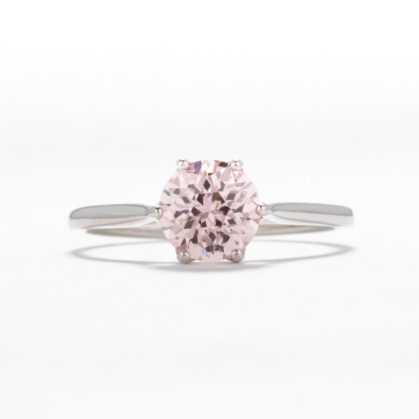 daphnis engagement ring with peach lab sapphire