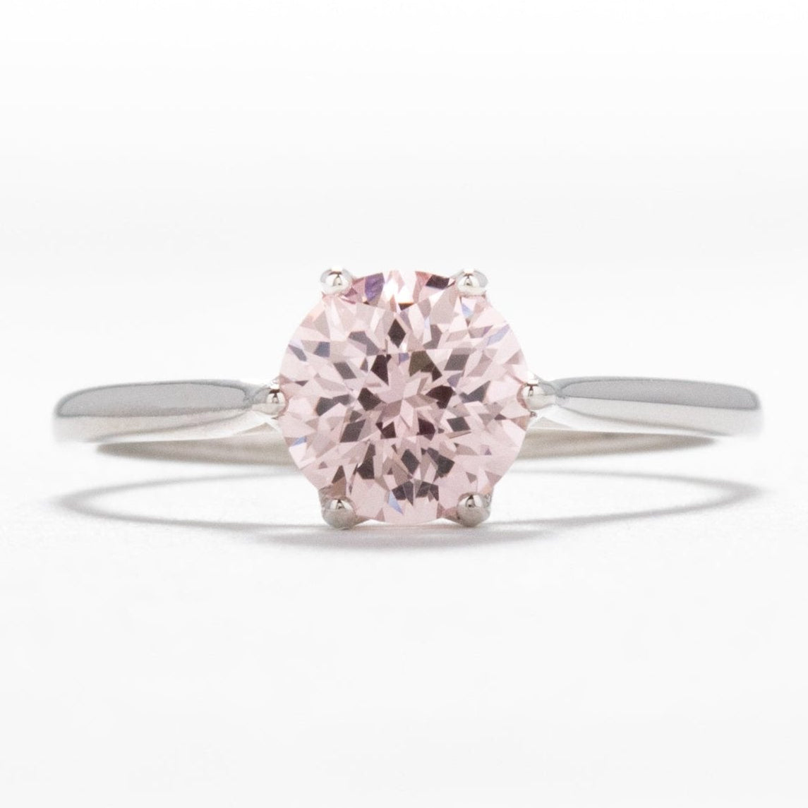 daphnis engagement ring with peach lab sapphire
