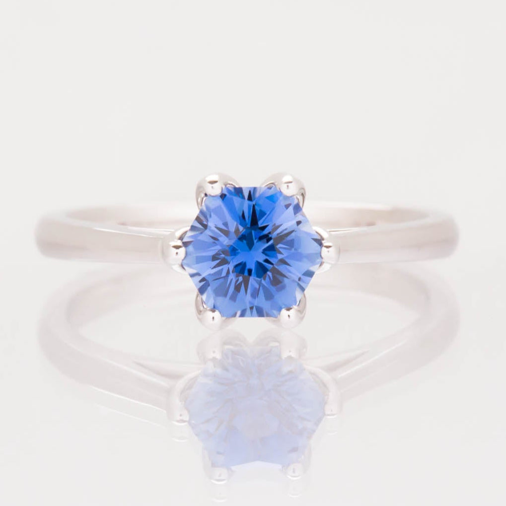 daphnis solitaire engagement ring with blue lab sapphire