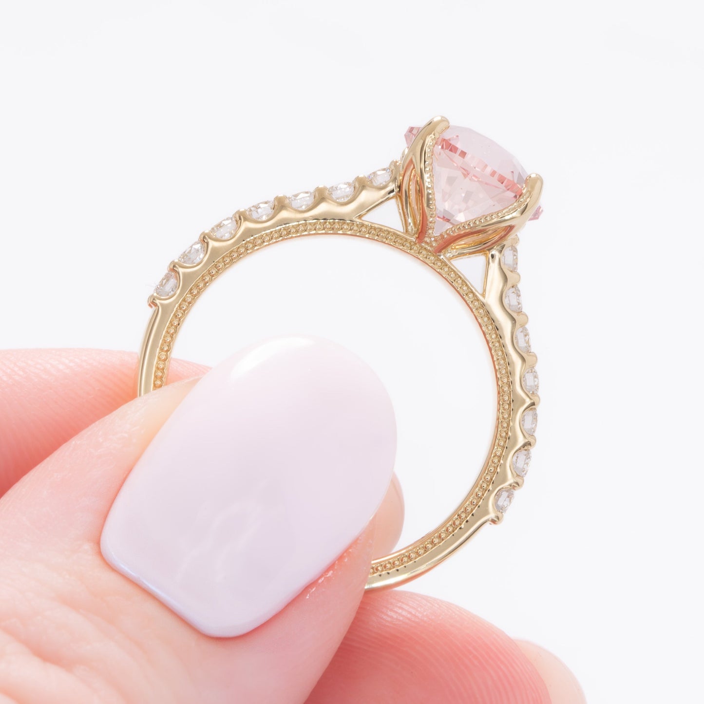 della engagement ring with round pink lab sapphire