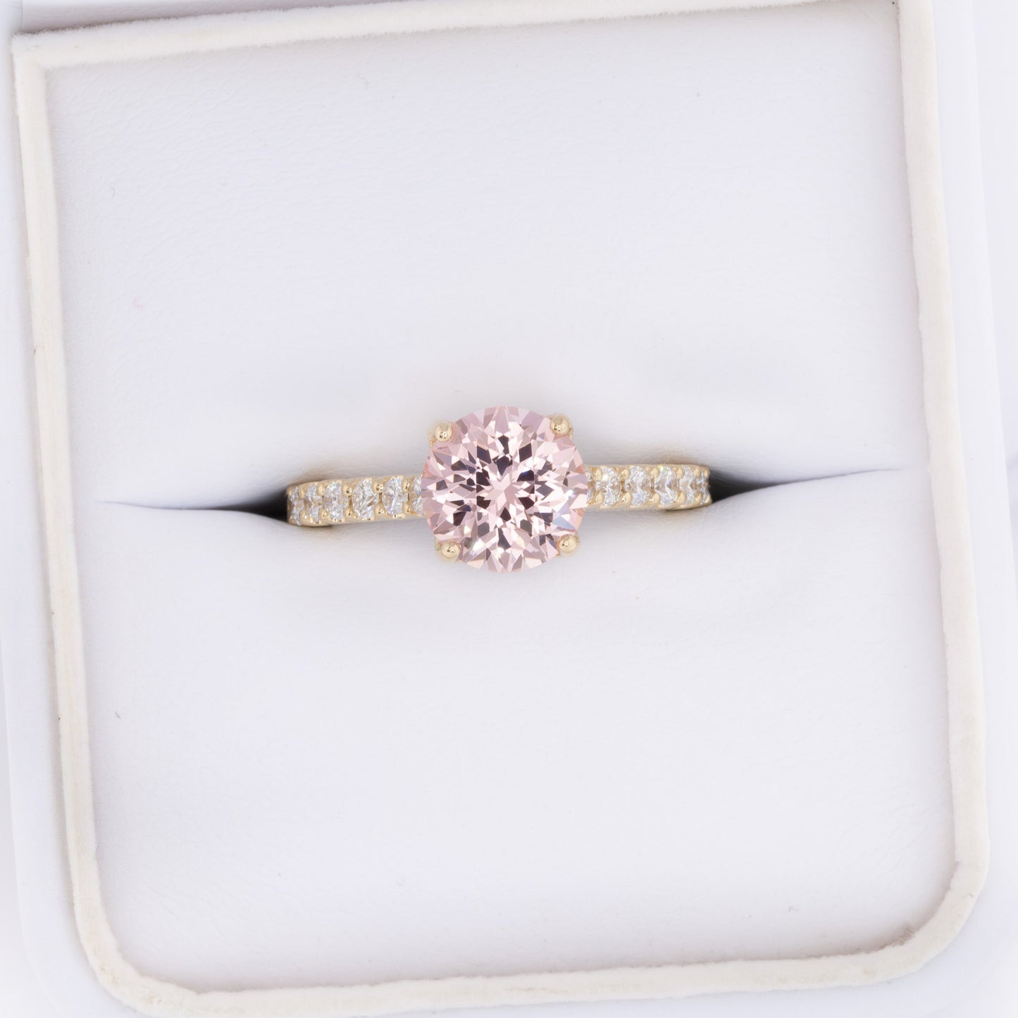 della engagement ring with round pink lab sapphire