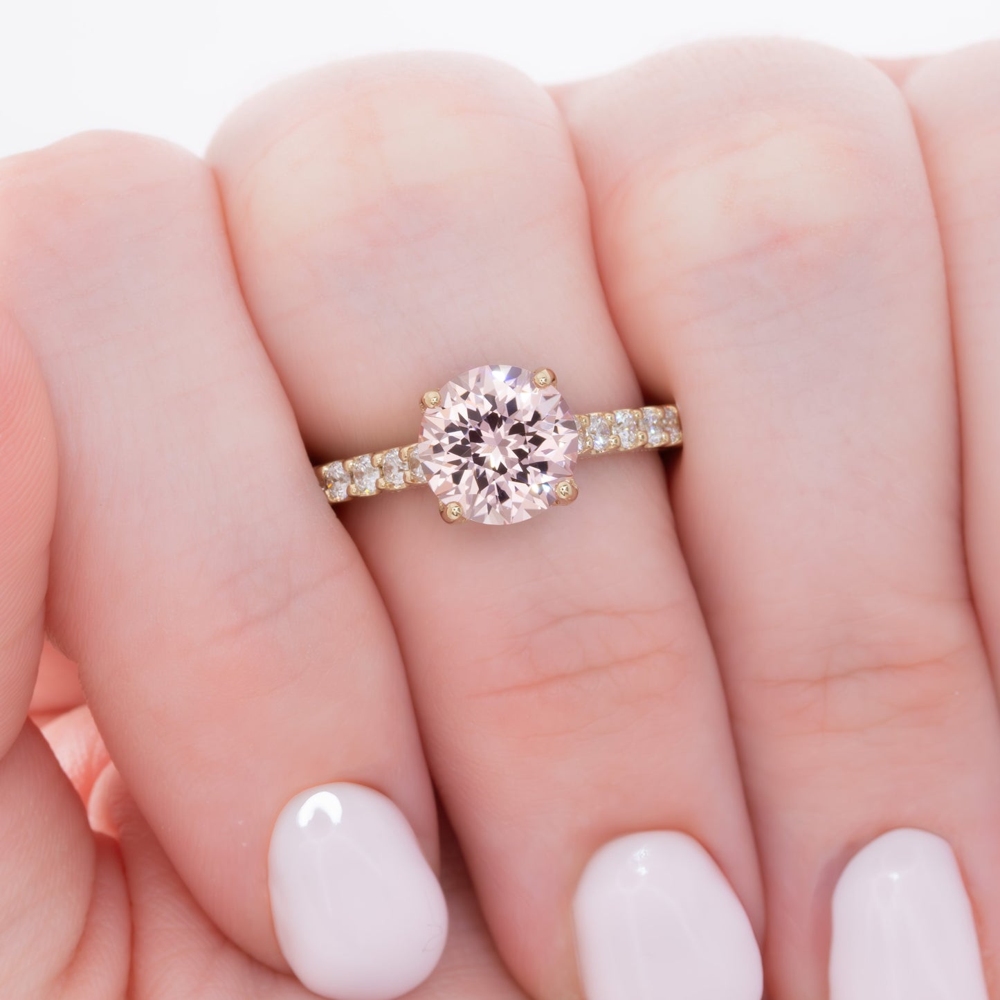 della engagement ring with round pink lab sapphire