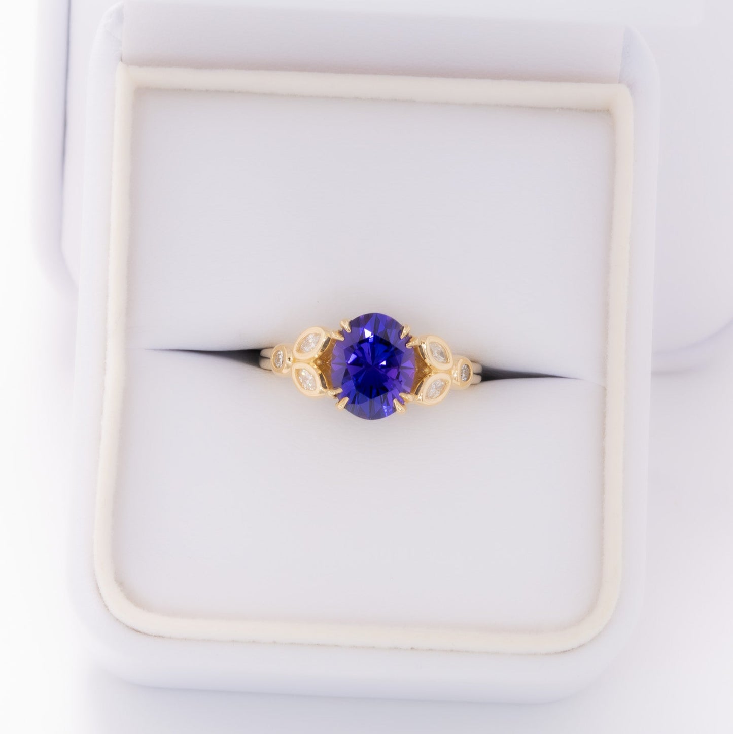 eloise engagement ring in yellow gold with oval purple lab sapphire