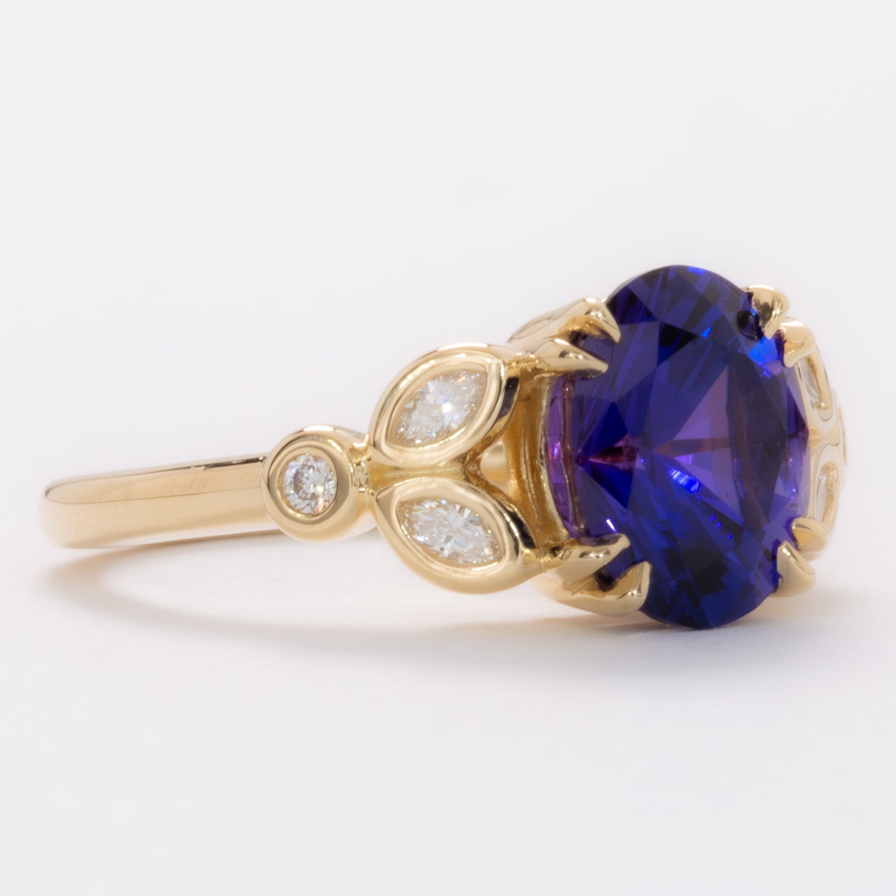 eloise engagement ring in yellow gold with oval purple lab sapphire