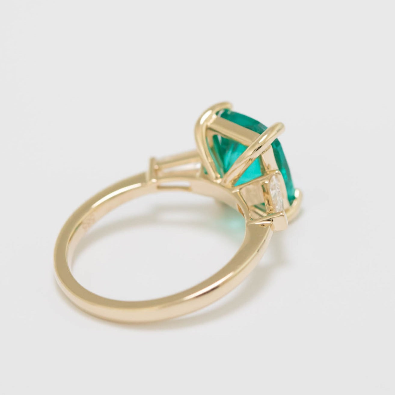 elongated cushion three stone engagement ring