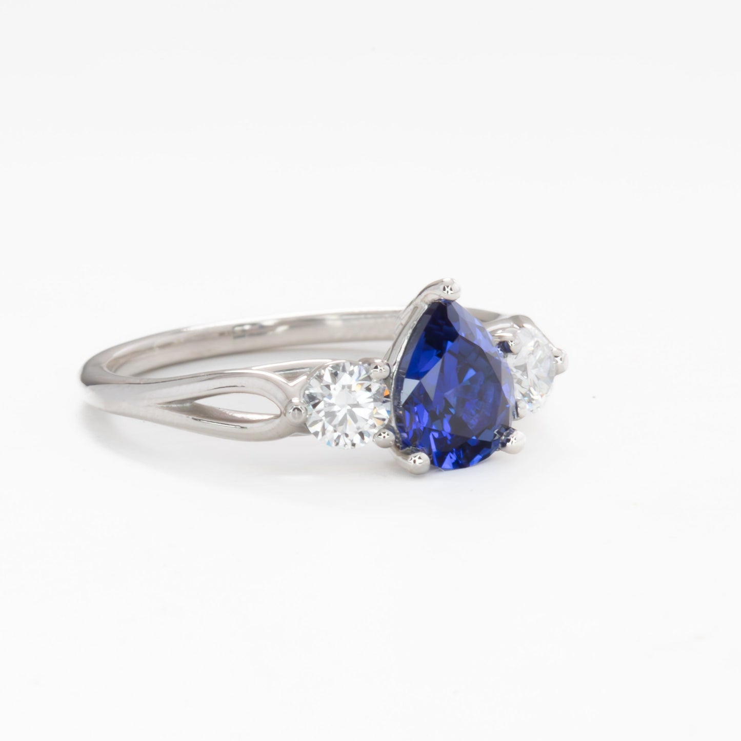 emryn three stone engagement ring with pear blue lab sapphire