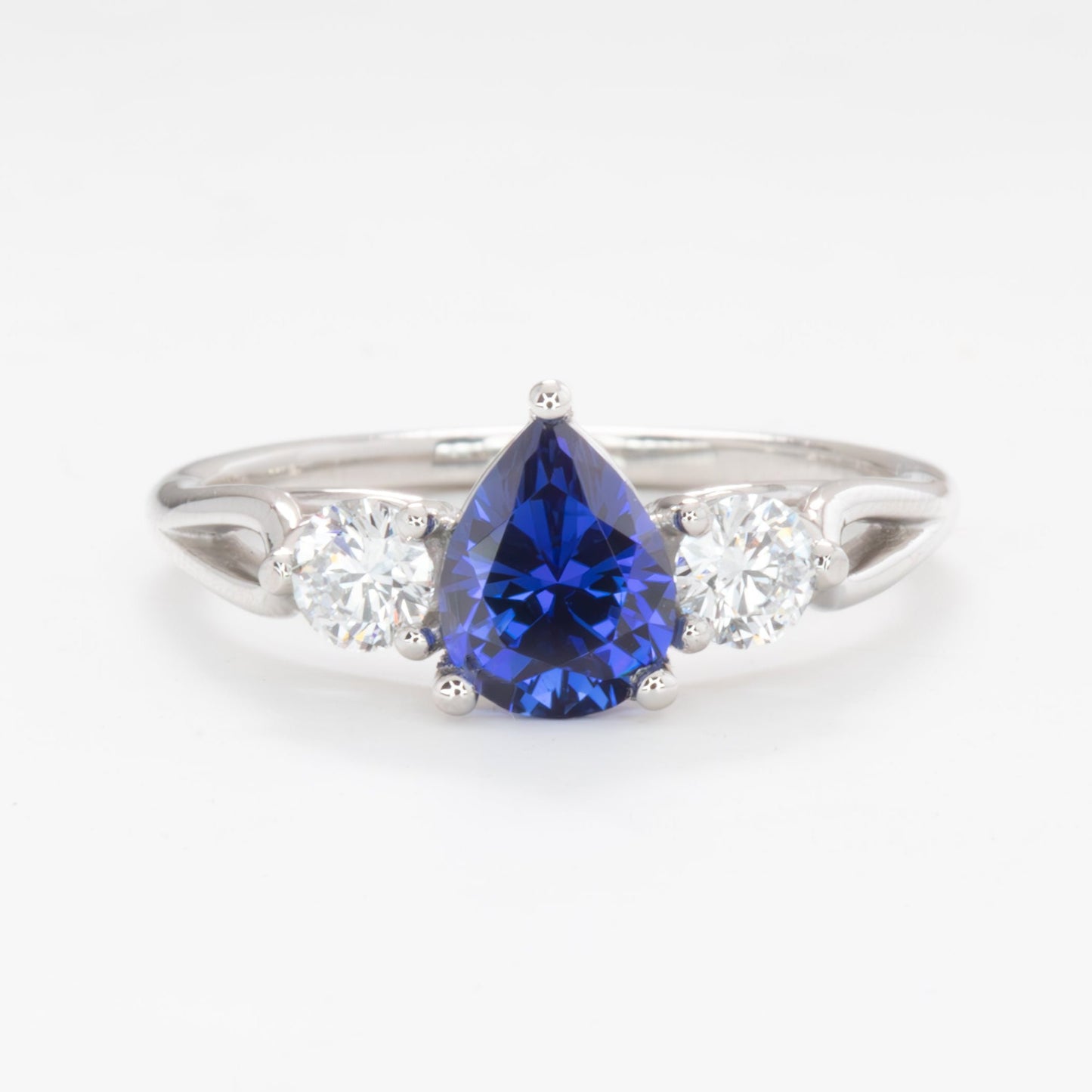 emryn three stone engagement ring with pear blue lab sapphire