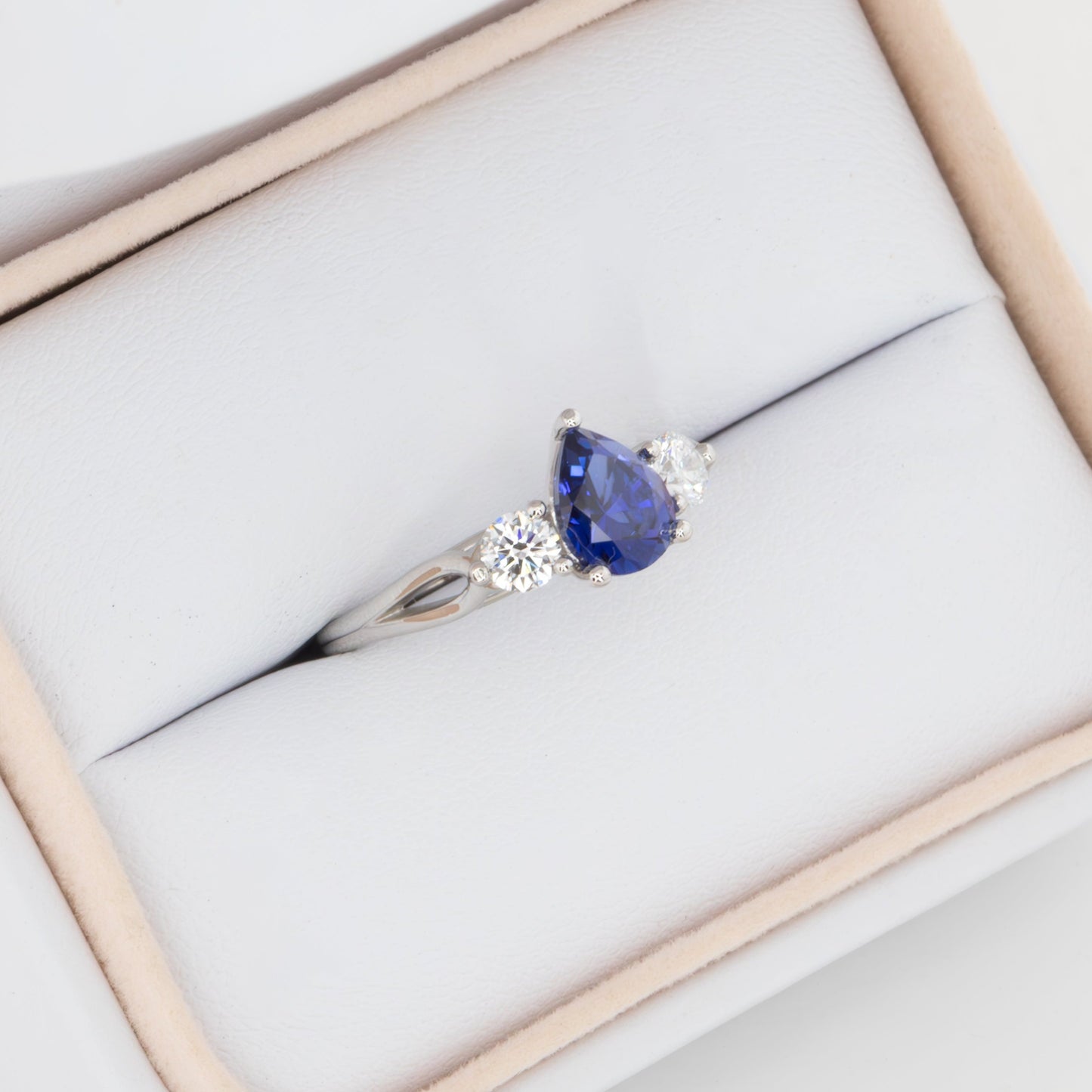 emryn three stone engagement ring with pear blue lab sapphire