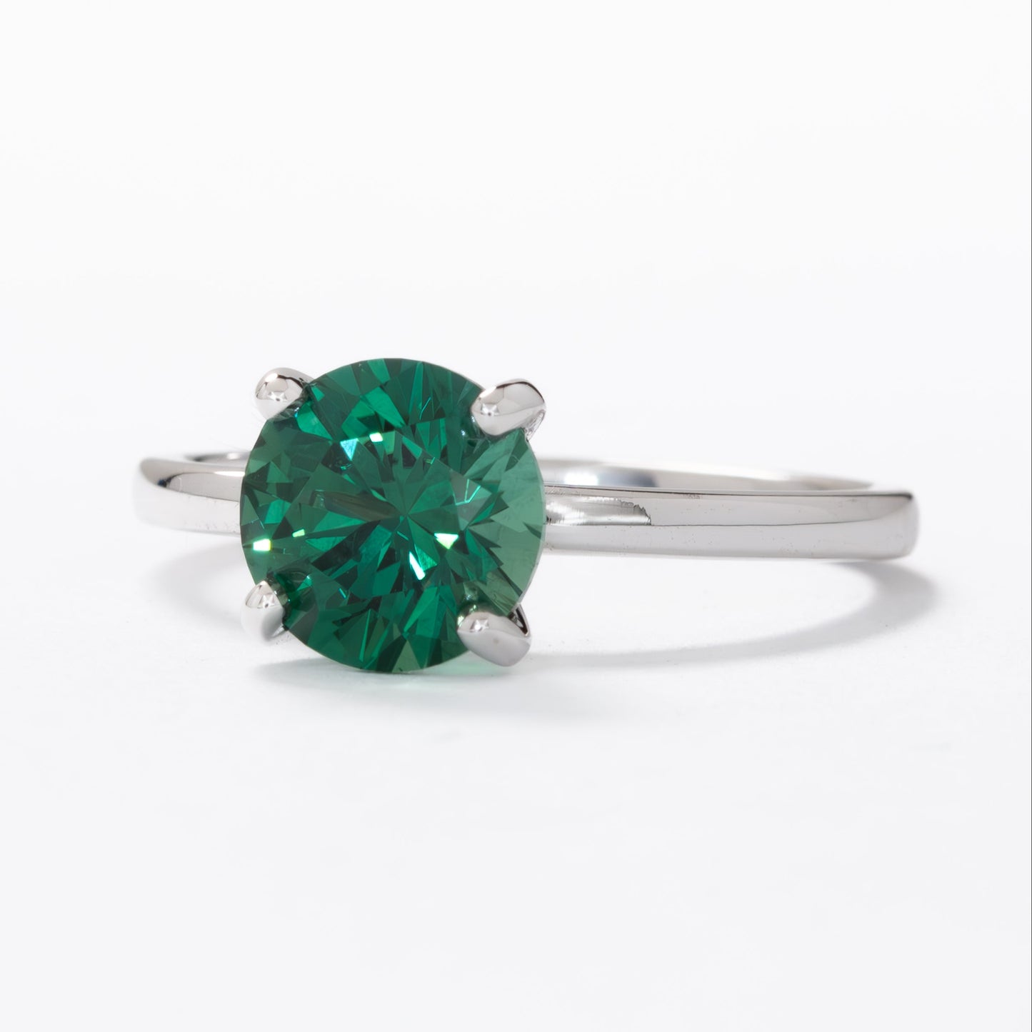 evie engagement ring with green lab sapphire round