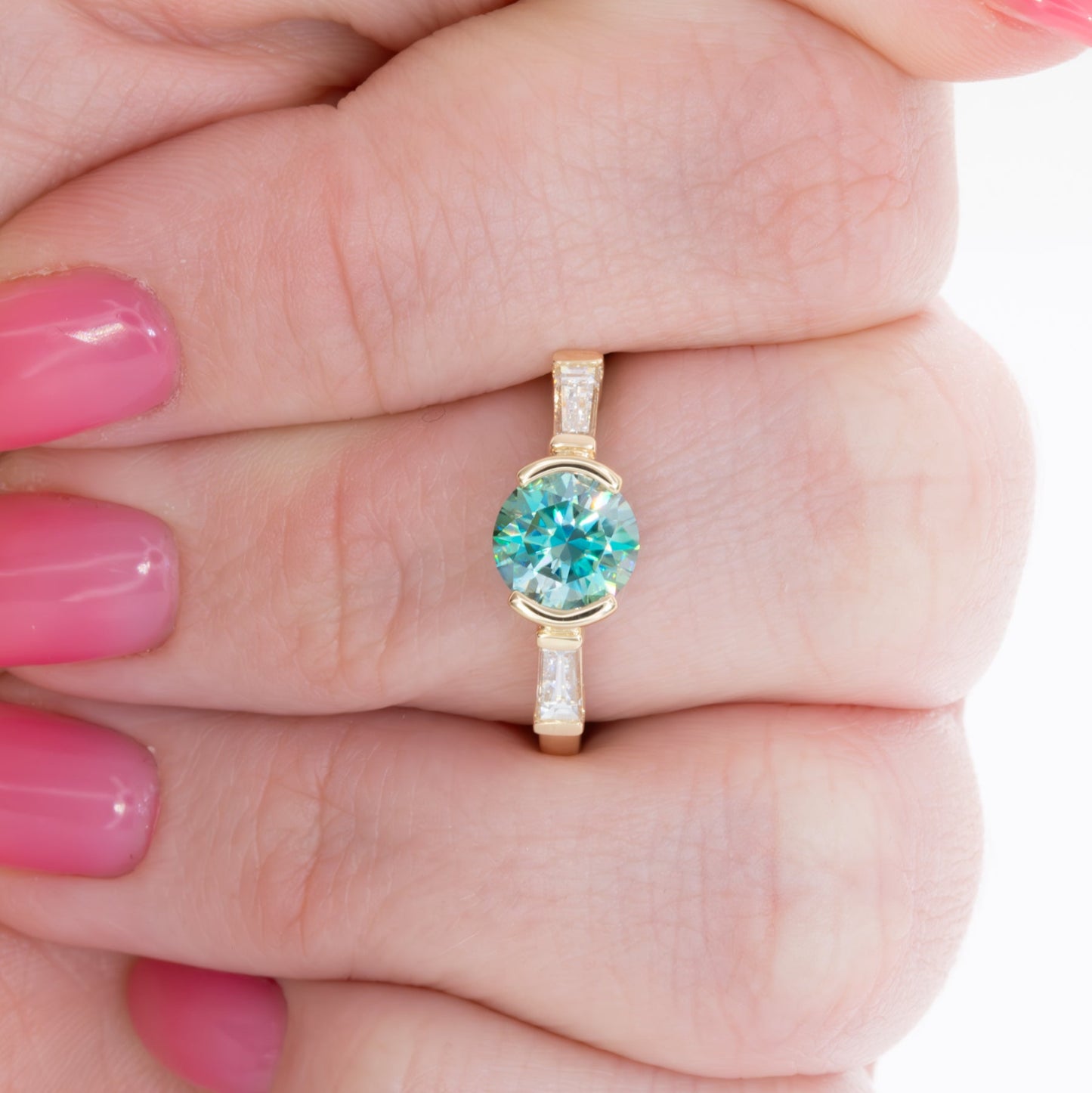 ezri three stone engagement ring with round blue-green moissanite