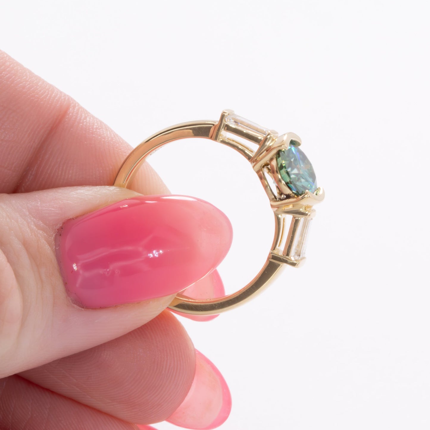 ezri three stone engagement ring with round blue-green moissanite