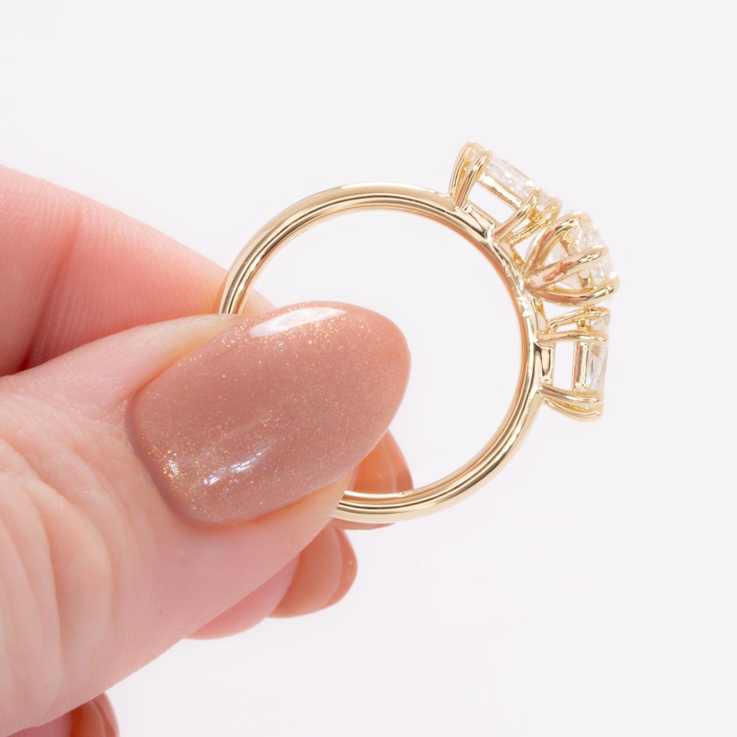 felicity three stone engagement ring with marquise lab diamond