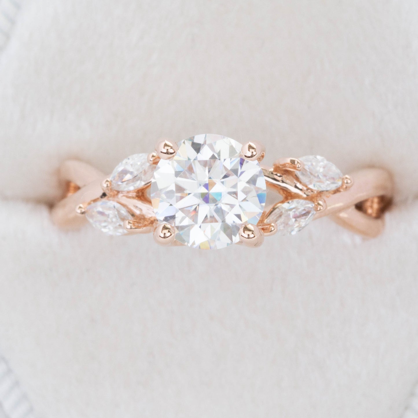 floral inspired engagement ring with moissanite