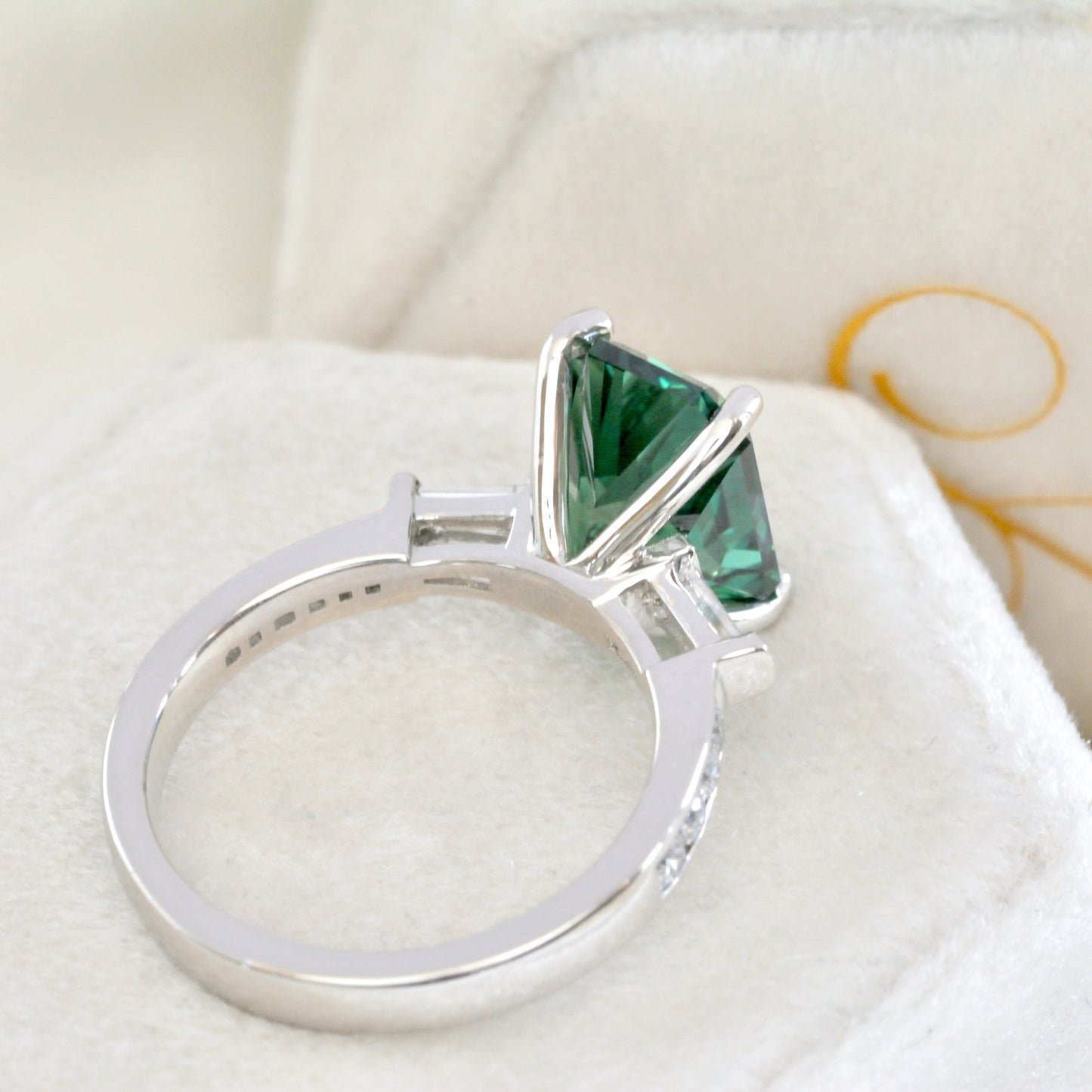 custom engagement ring green lab sapphire and tapered baguettes