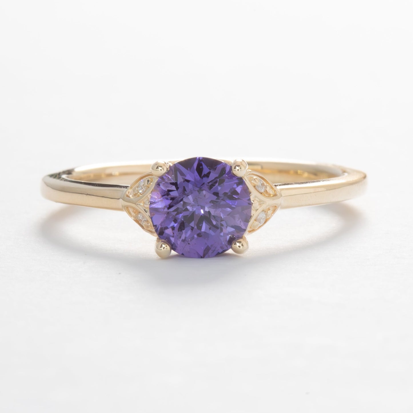 krystal engagement ring in yellow gold and purple lab sapphire