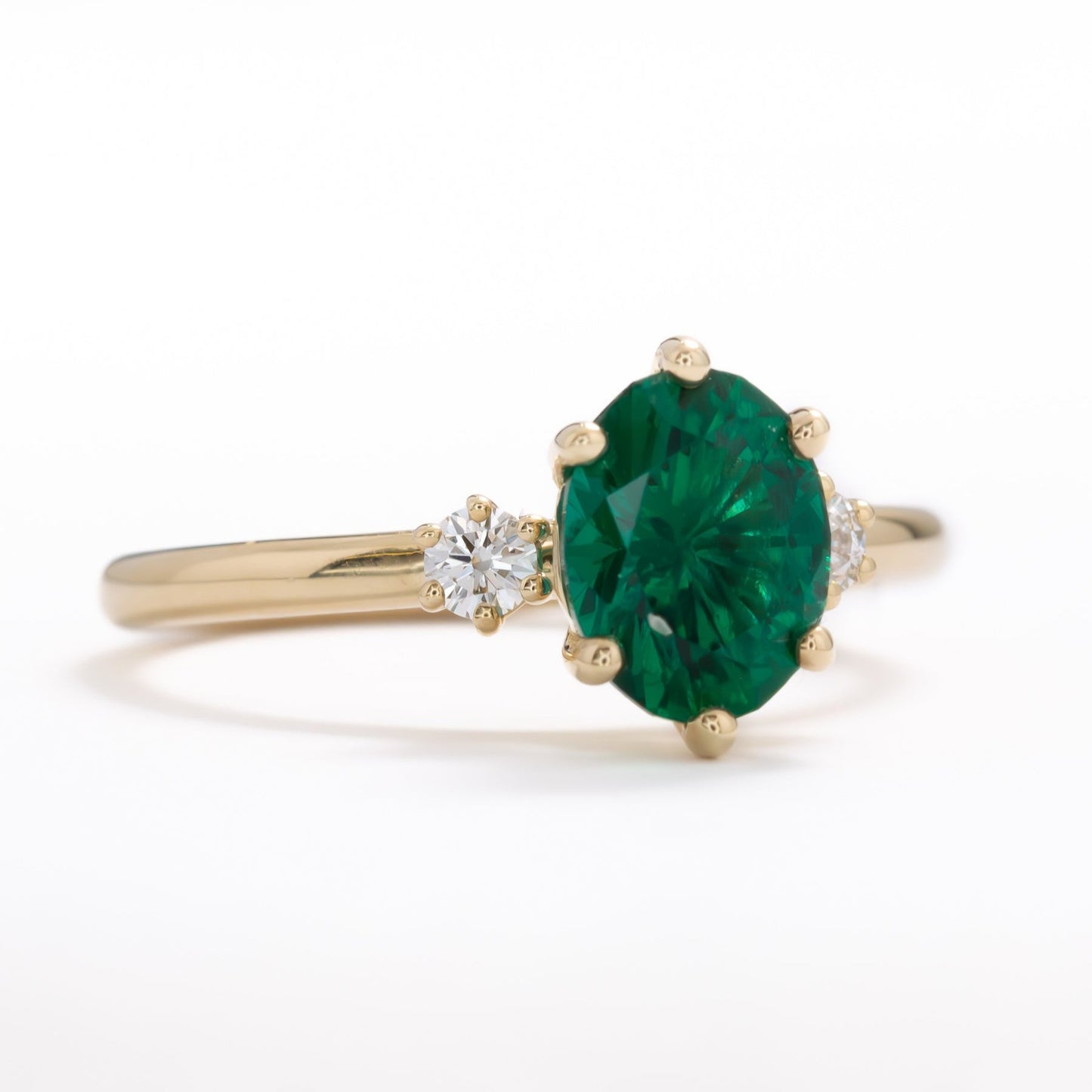 lab emerald oval three stone engagement ring