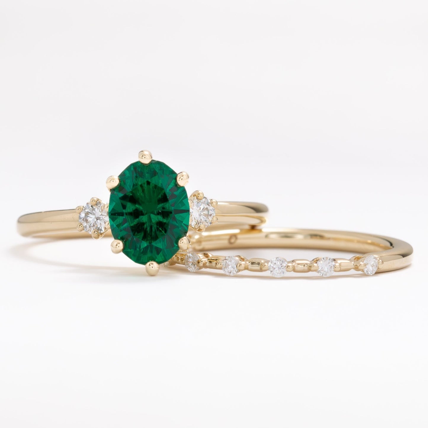 lab emerald oval three stone engagement ring