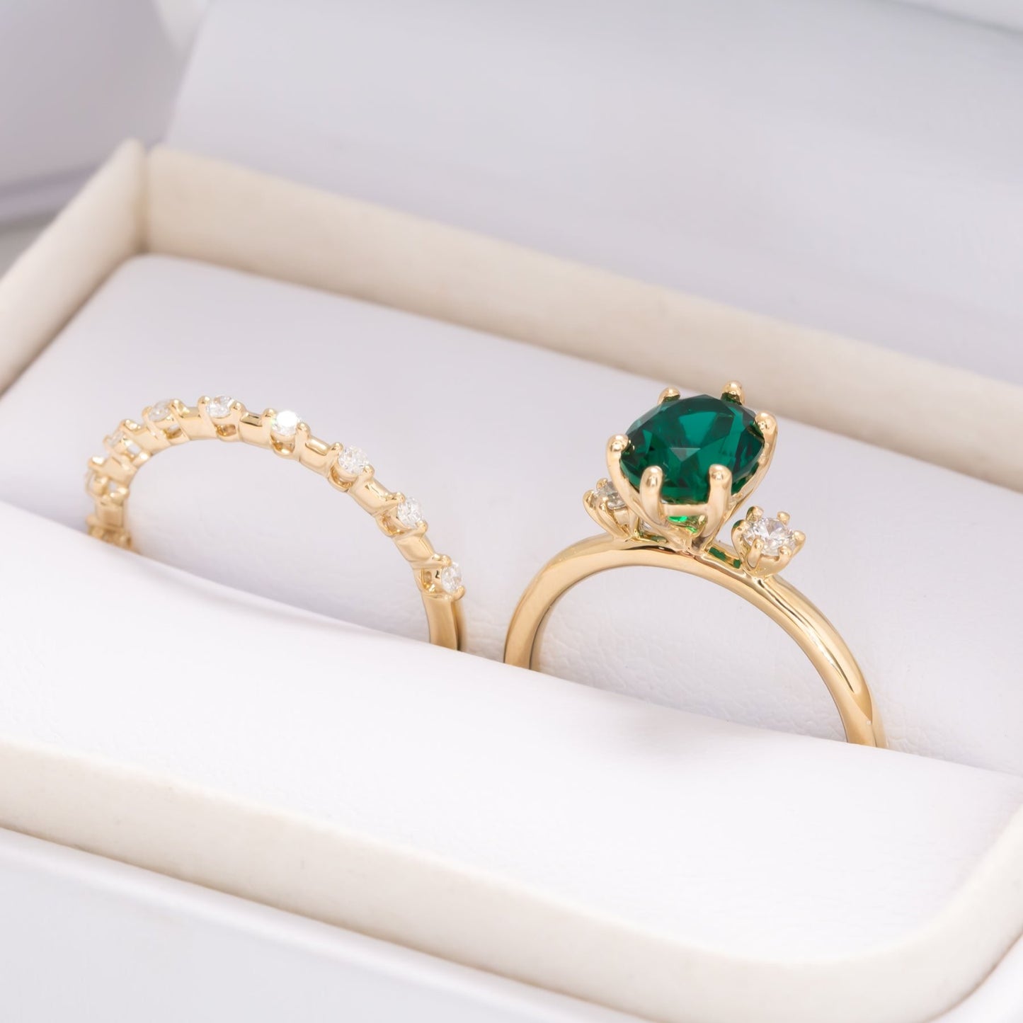 lab emerald oval three stone engagement ring