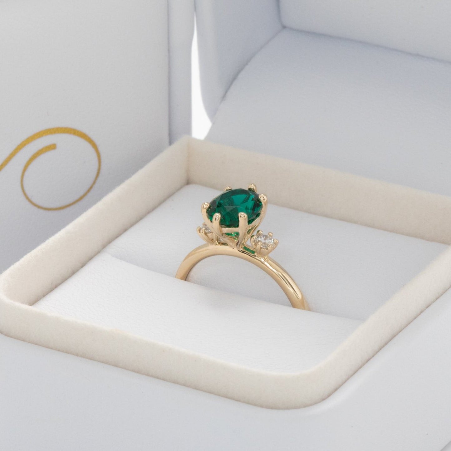 lab emerald oval three stone engagement ring