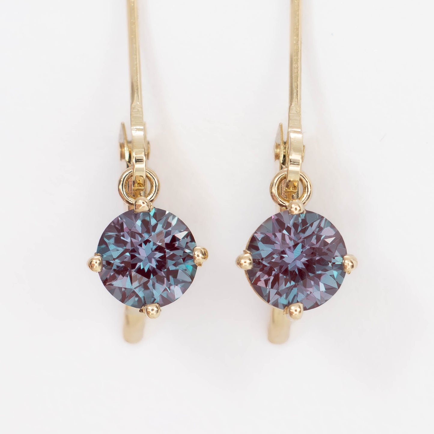 lever back earrings in yellow gold with round lab alexandrite