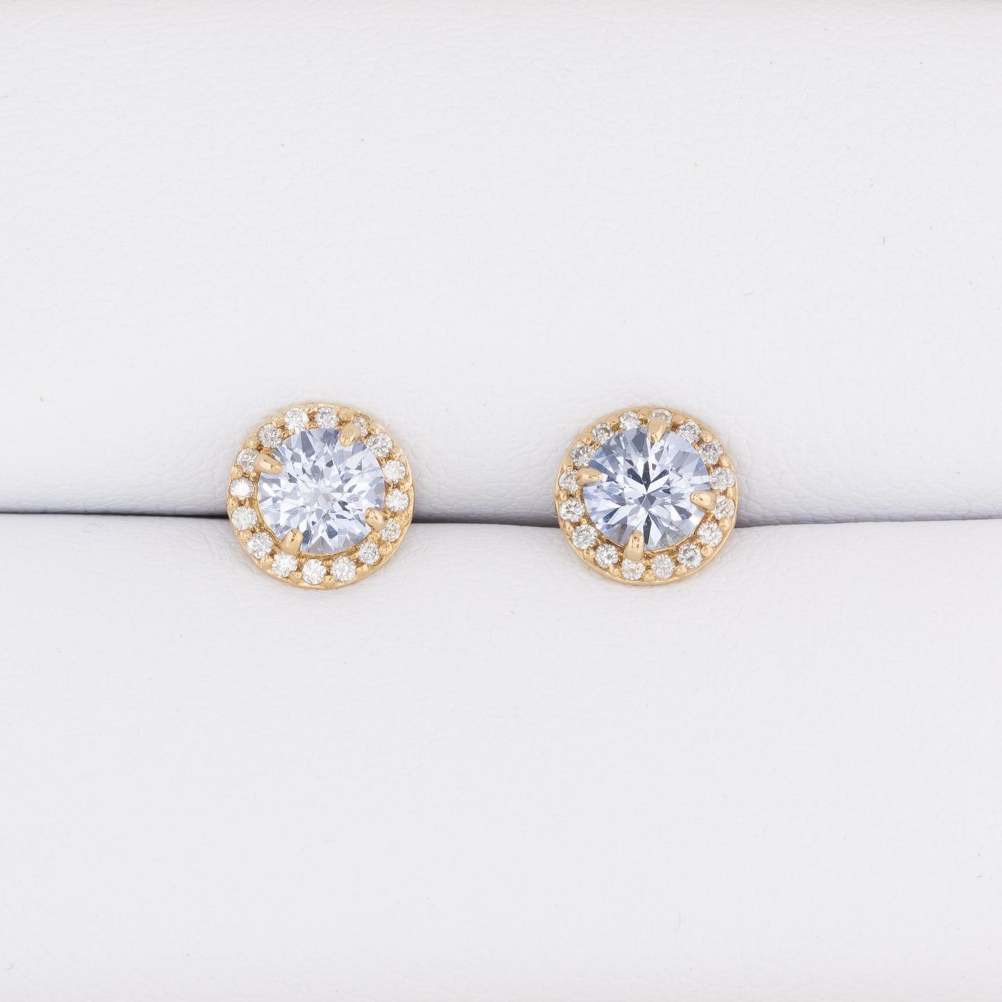 light blue lab sapphire halo earrings