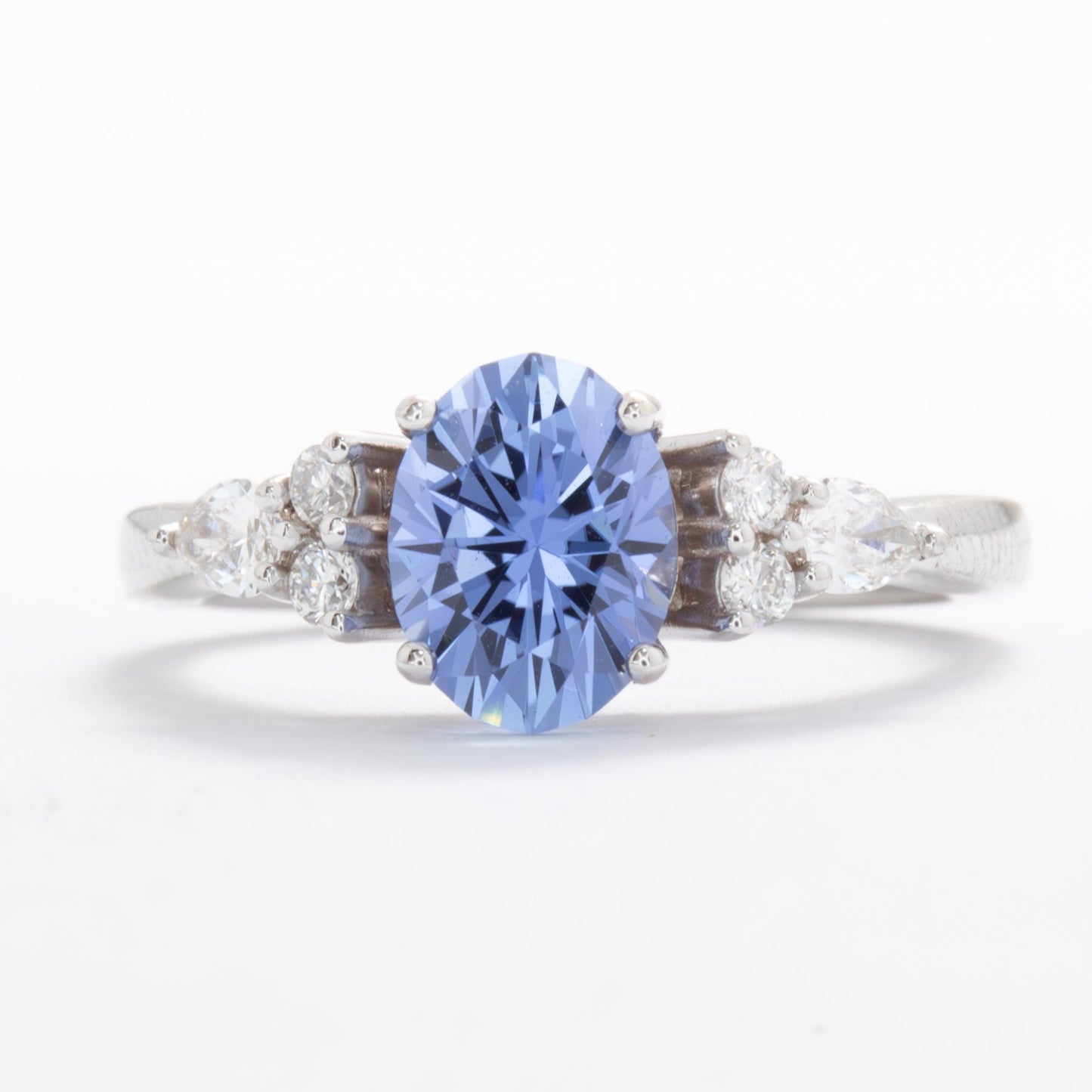 light blue oval engagement ring with lab diamonds