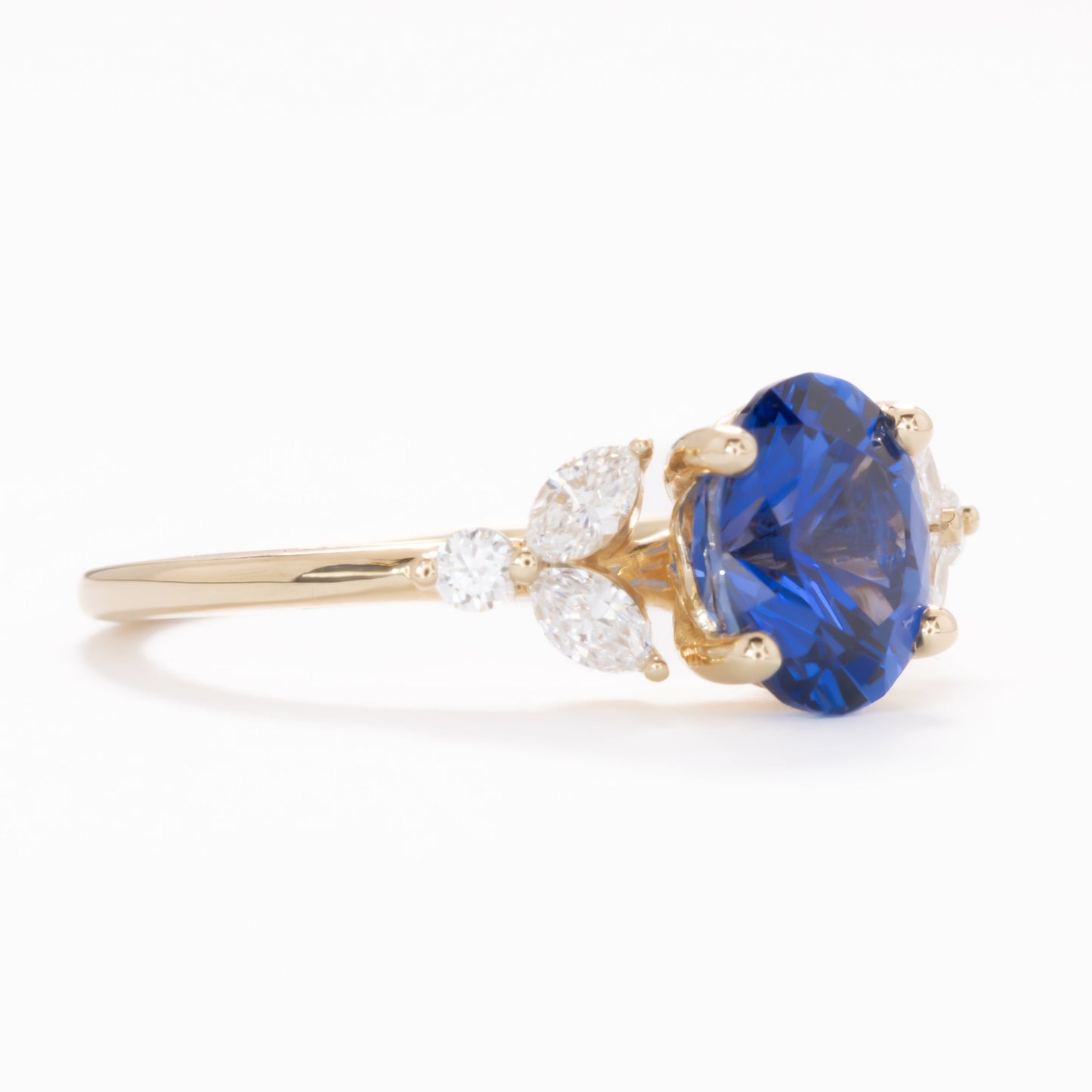 lili floral inspired engagement ring with oval lab sapphire