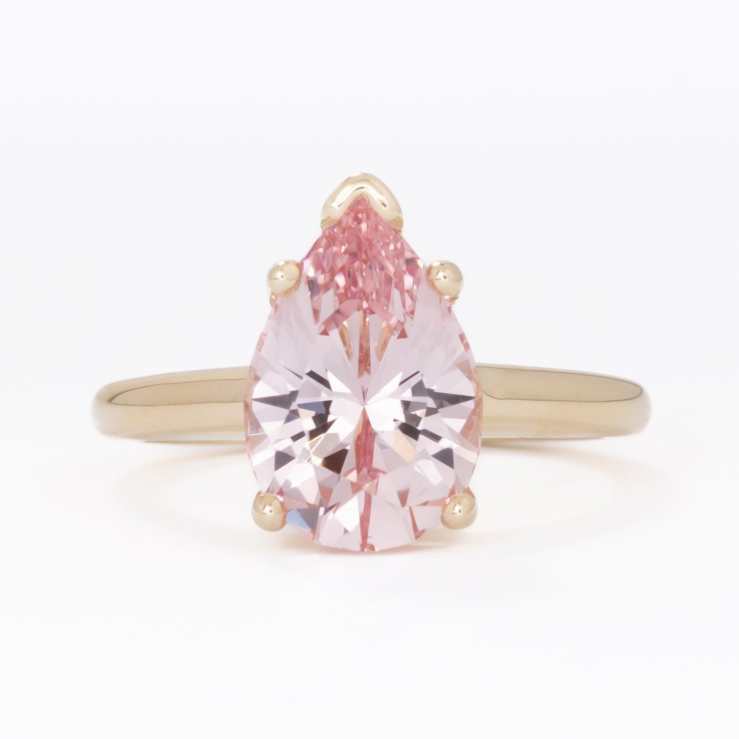 liv solitaire ring with peach lab sapphire pear