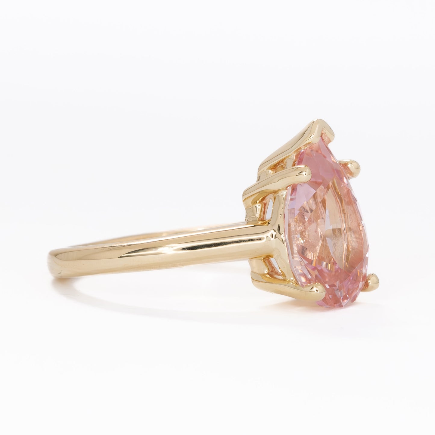 liv solitaire ring with peach lab sapphire pear