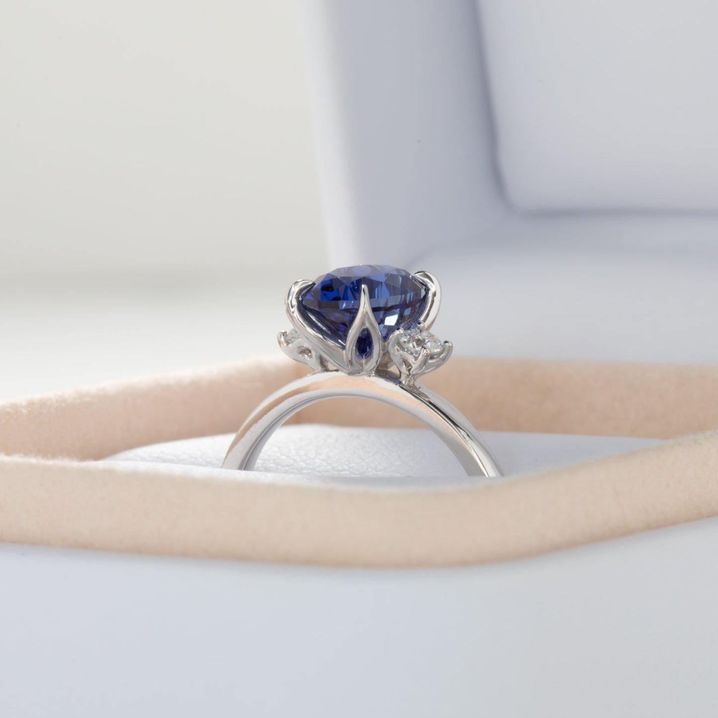 mabel nature inspired petal basket ring with oval blue lab sapphire