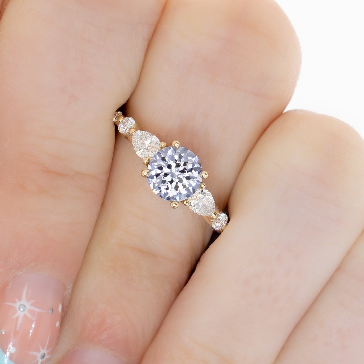 maeve ring in yellow gold with light blue round lab sapphire