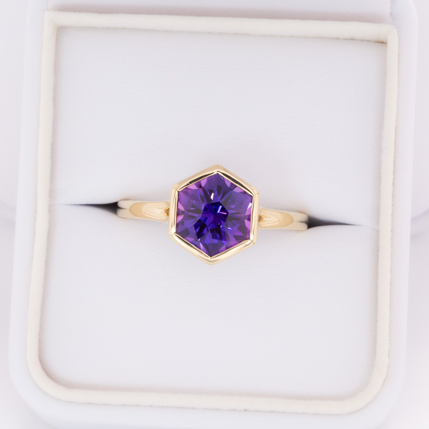 margot bezel set solitaire ring with hex cut lab sapphire