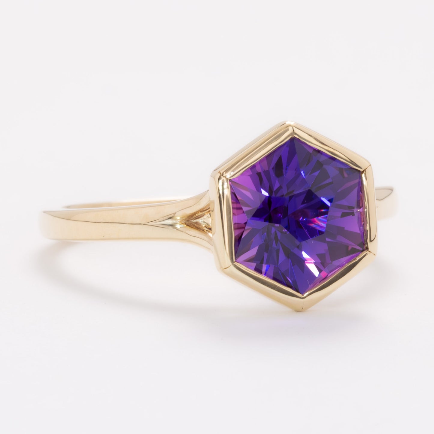 margot bezel set solitaire ring with hex cut lab sapphire