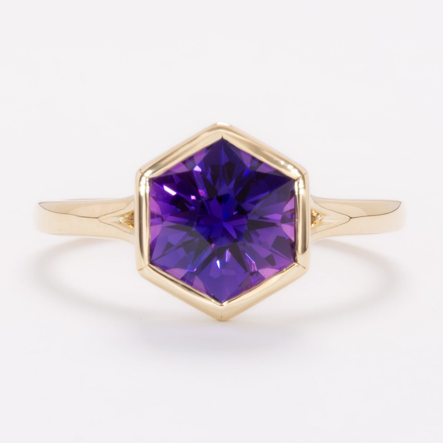 margot bezel set solitaire ring with hex cut lab sapphire