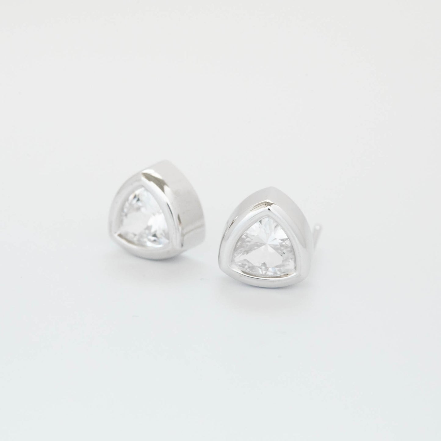 bezel set white sapphire earrings