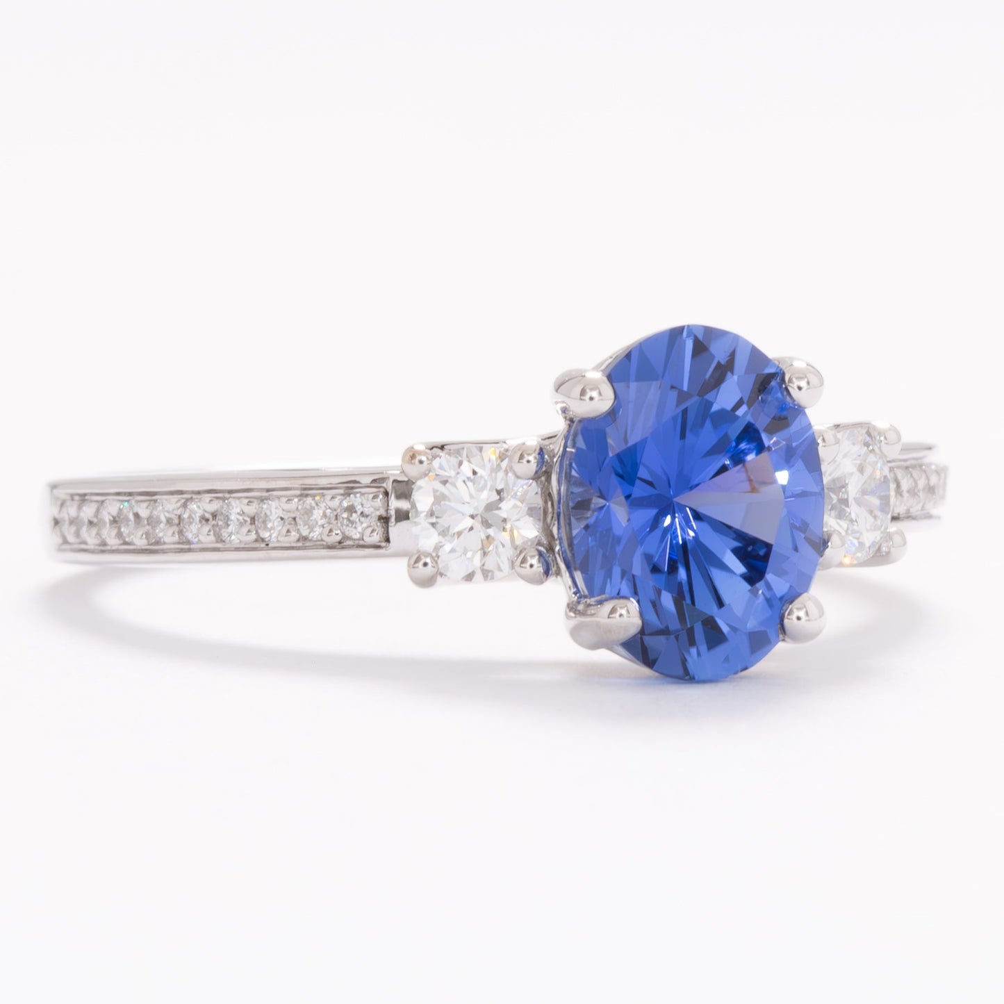 oriane three stone engagement ring with blue oval lab sapphire