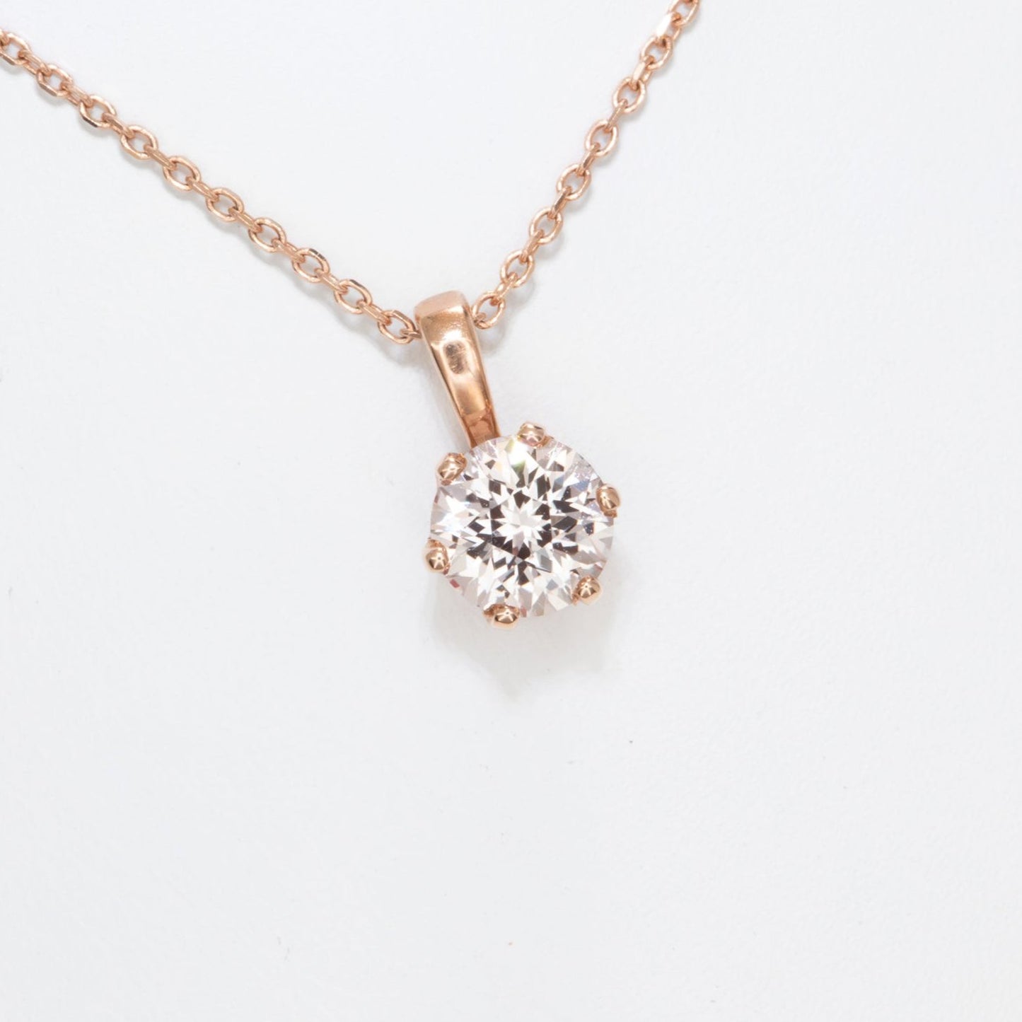 pale pink lab sapphire in rose gold necklace