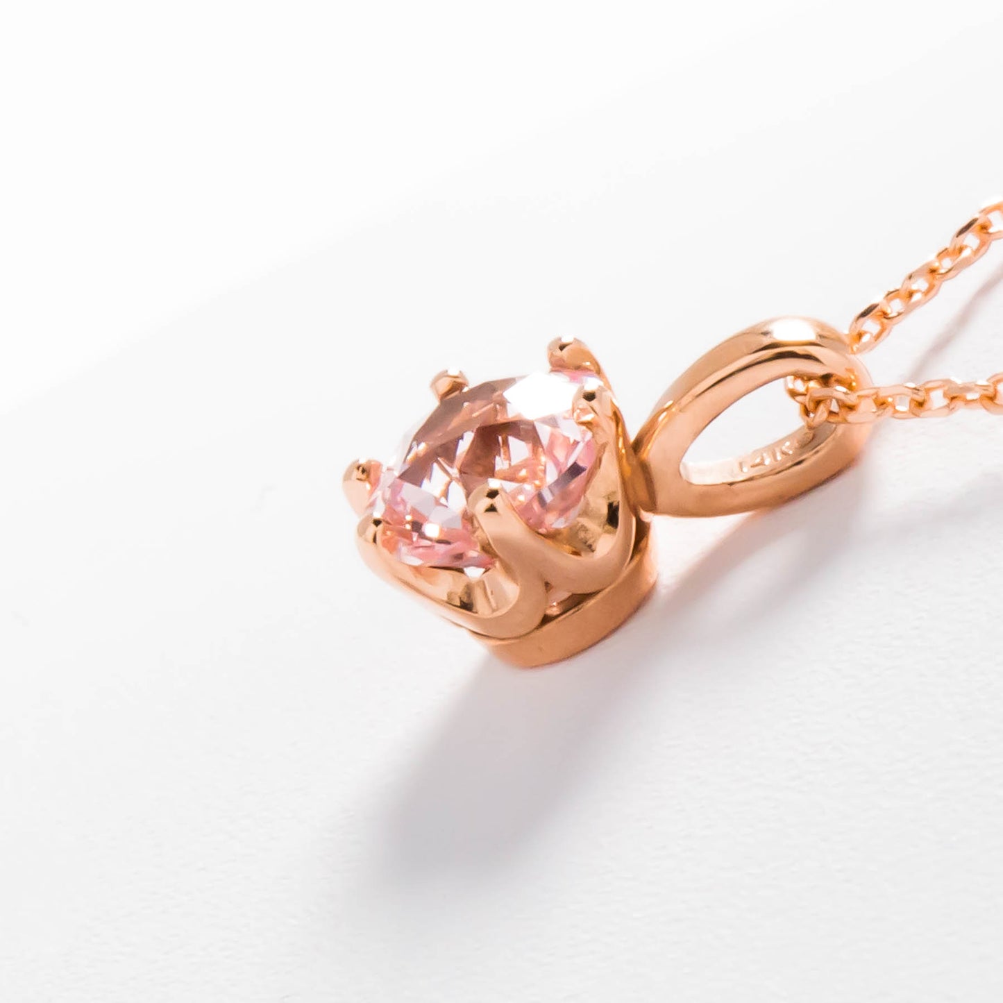 pale pink lab sapphire in rose gold necklace