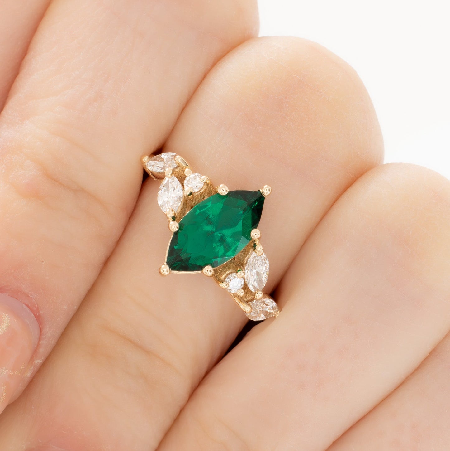 paola engagement ring with marquise lab emerald in yellow gold