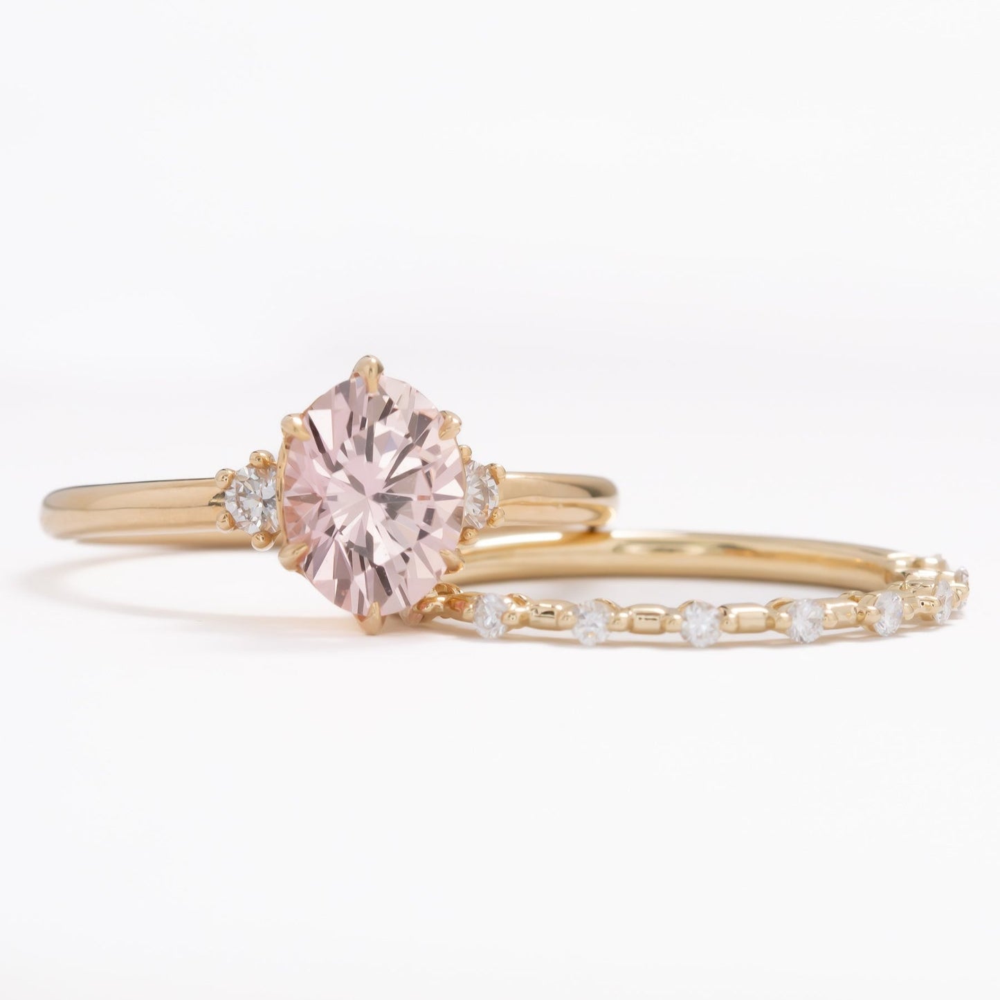 peach lab sapphire oval three stone engagement ring