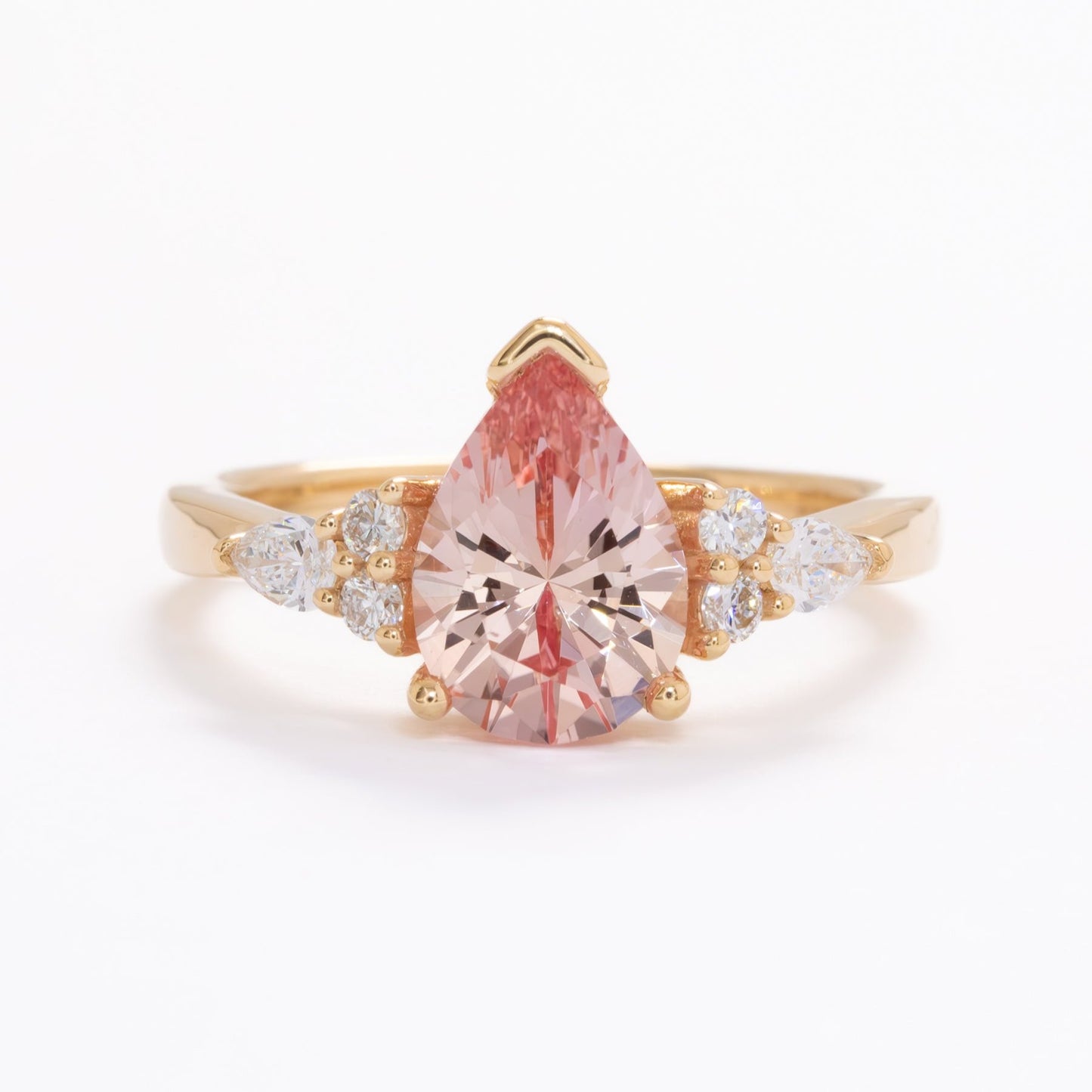 peach lab sapphire pear engagement ring