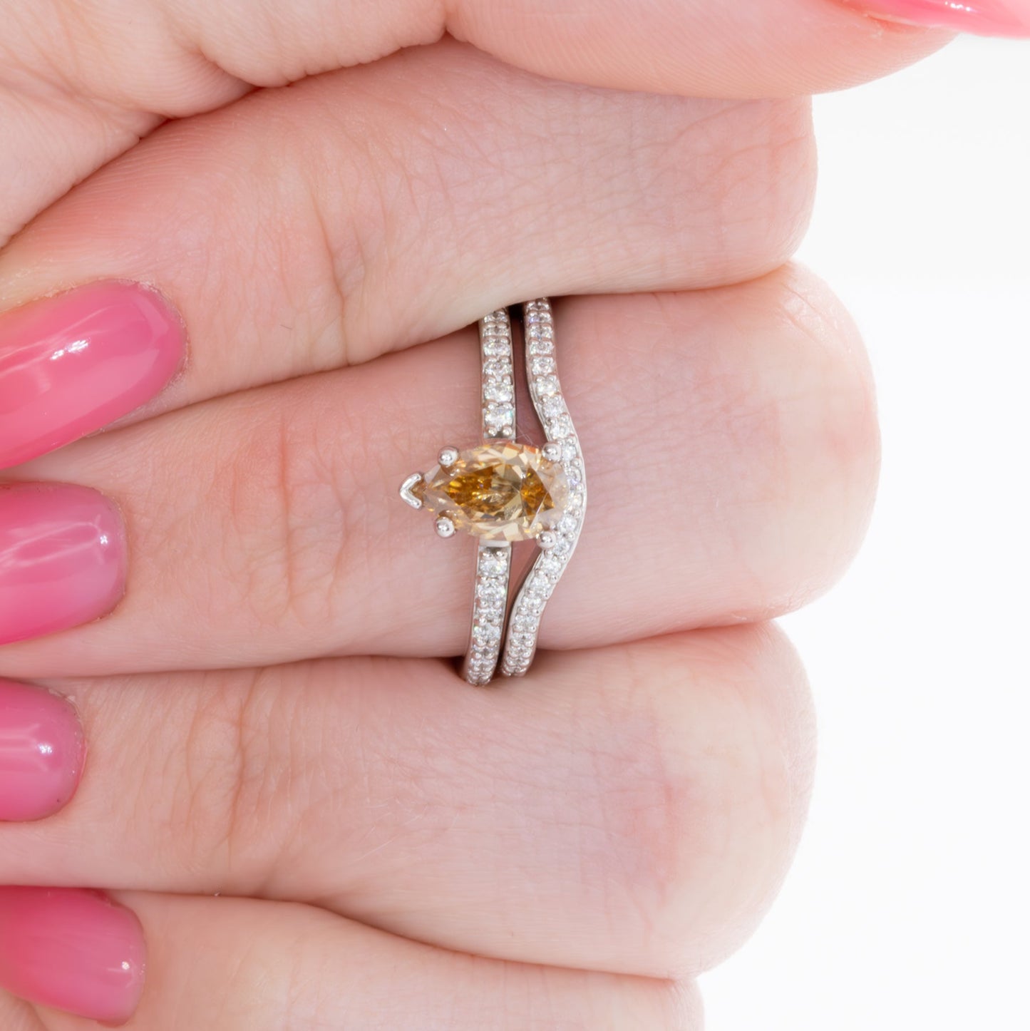 pear gold moissanite engagement ring in white gold