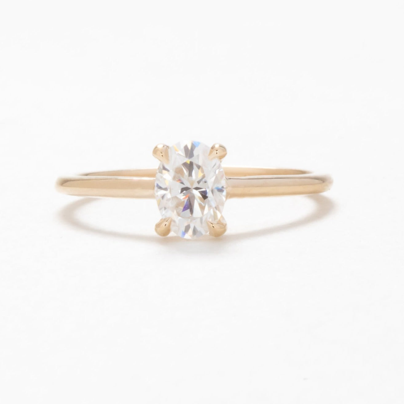 petite oval solitaire engagement ring